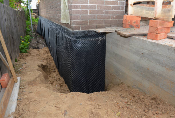 SJ Waterproofing Pros technician performing targeted Waterproofing assessment in La Follette, TN